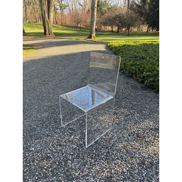 A vintage lucite desk or accent chair in wonderful condition. This chair is not only comfortable but versatile in mixing...
