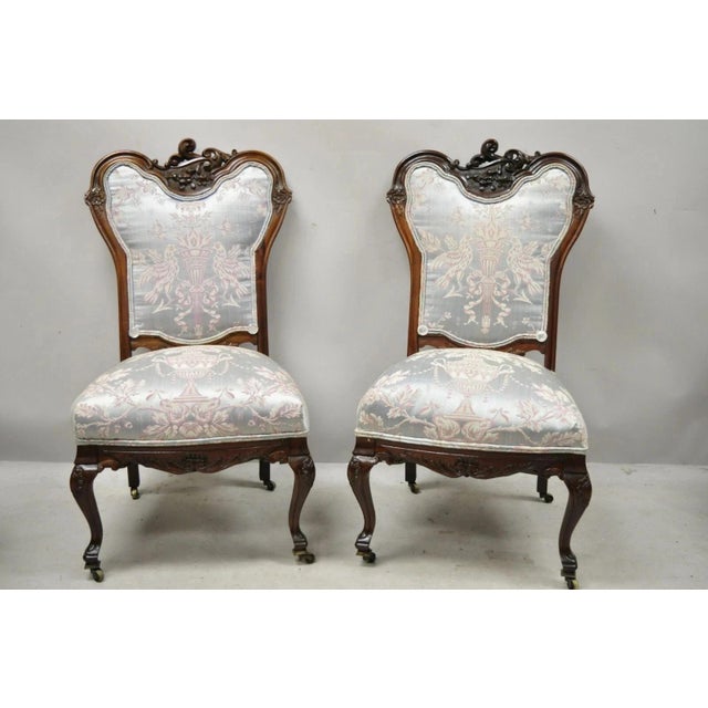 Antique Victorian Floral Scrollwork Carved Mahogany Parlor Slipper Side Chairs - a Pair. Item features floral scrollwork...