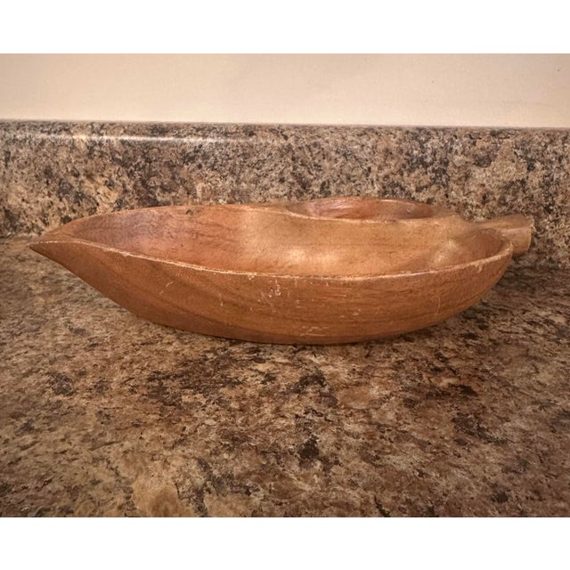 Charming vintage leaf-shaped serving bowl, hand-carved from warm-toned hardwood. It features two sections—perfect for...