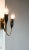 Beautiful Italian brass wall lamp. The lamp consists of two brass arms with black metal fixtures. It is in a nice and...