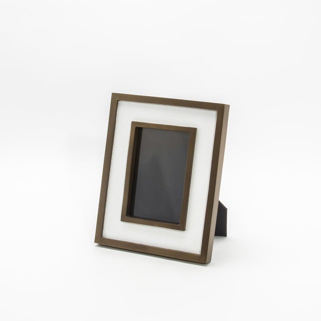 This exquisite 5x7” picture frame by R&Y Augousti is an embodiment of timeless elegance and refined craftsmanship. The...