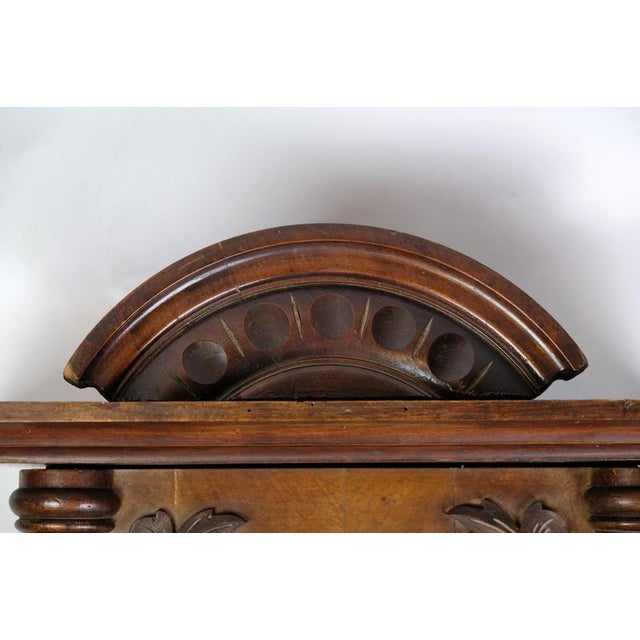 Antique wall clock from the 1920s, manufactured by Junghans in walnut. Dimensions: H:75cm W:40cm D:19cm. This piece is...