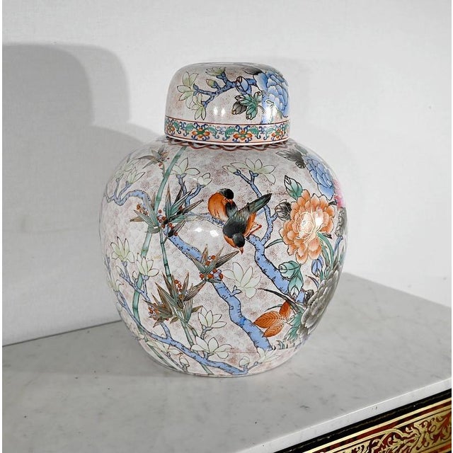 Large Chinese porcelain pot richly decorated with polychrome decorations. This very pansu and soft Asian object is painted...