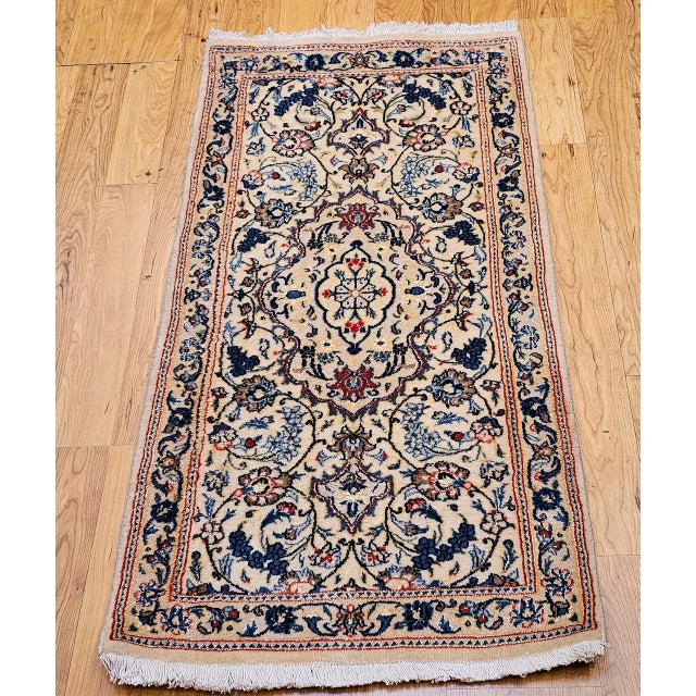 "A finely handwoven Persian Nain area rug from the third quarter of the 20th century, this elegant piece features a...