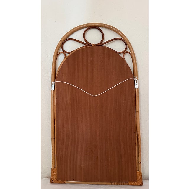 This spectacular 1960s wall mirror, handcrafted in Spain, stands out for its imposing size and refined rattan and natural...