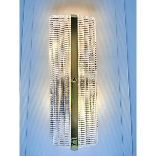 Set of two trasparent diamanted Murano glass wall sconces with Metal frame on view in Gold 24k Murano glass with a...