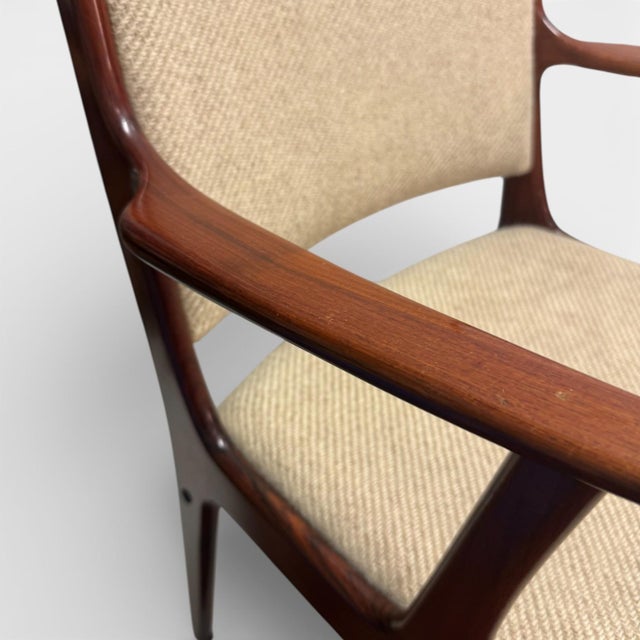 Danish mid-century modern armchair attributed to Johannes Andersen for Uldum Møbelfabrik, Denmark, 1960s. Crafted in...