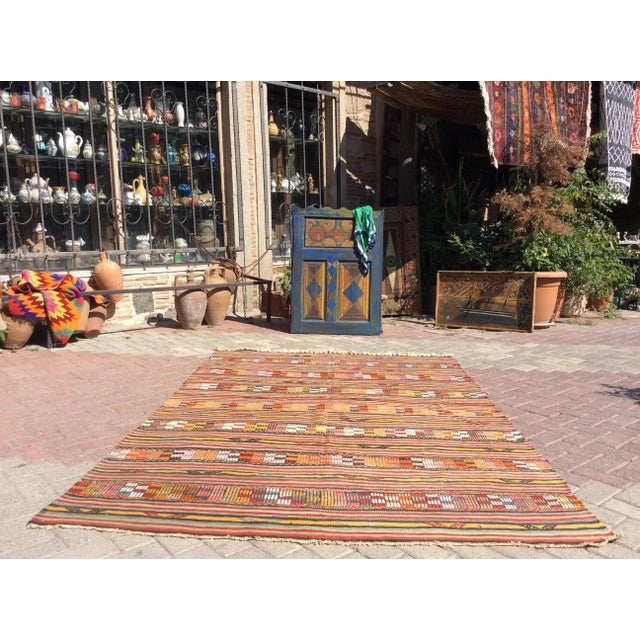 This beautiful, vintage, handwoven kilim is approximately 60 years old. It is handmade, of very fine quality hand spun...