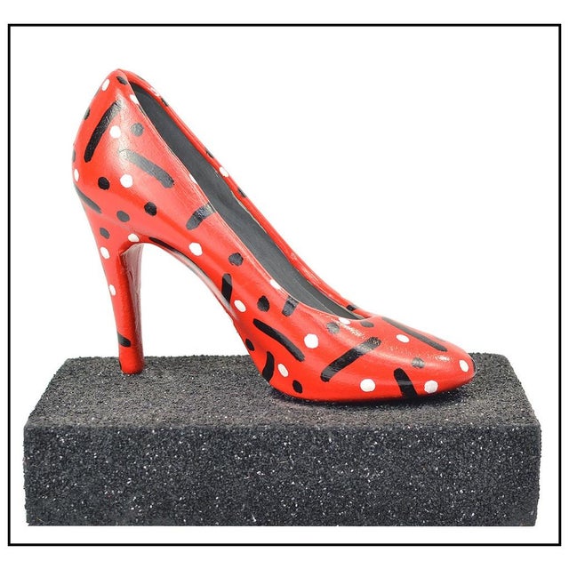 The artwork here, "Ruby Slipper", is a remarkable wood shoe had painted in acrylic and decorated with an intricate design,...