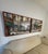 Elegant matching pair of framed European café scene artworks featuring richly layered architectural detail, warm neutral...