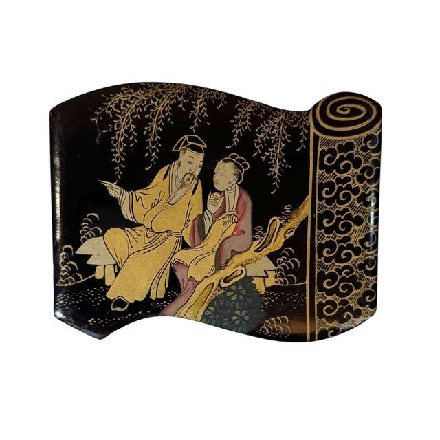 A large Chinese black lacquer work box dating from approximately 1800–1820. Shaped like a traditional scroll, it features...