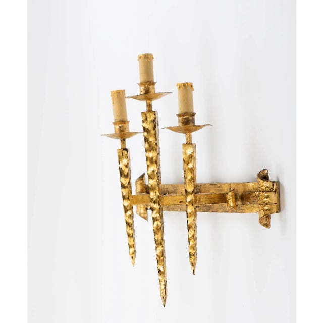 Vintage large Spanish gilt iron three light gothic style wall sconce, circa 1950s, has been fully rewired and is now ready...