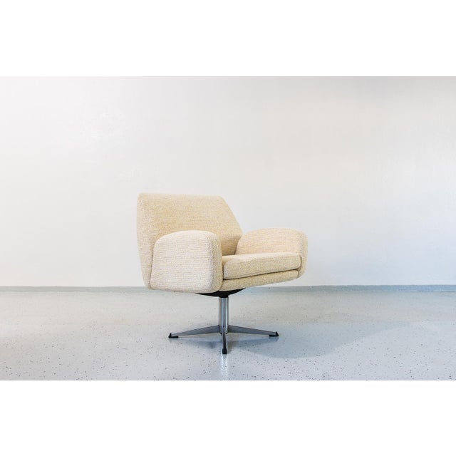 Vintage Swivel Armchair, Germany, 1970s Vintage armchair, originating from 1970s Germany, is a quintessential example of...