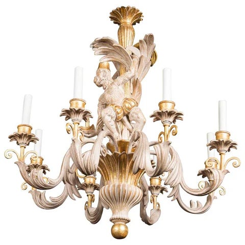 Offered is an Italian carved, solid wood Monkey chandelier. This piece has eight lights and a light finish with gilding....