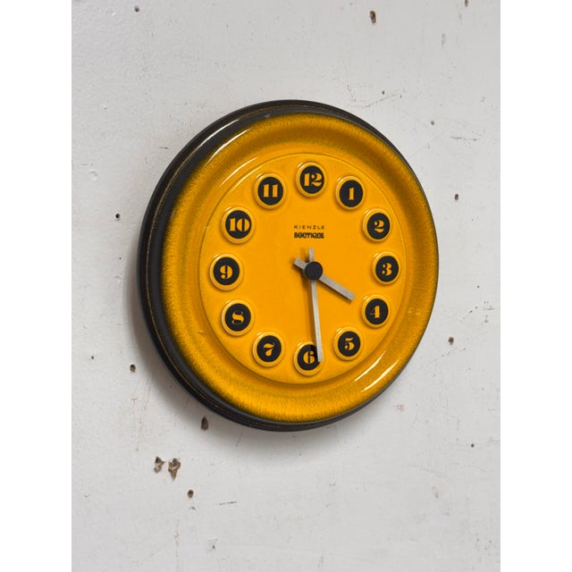 Design Plus Gallery presents a Vintage Ceramic Wall Clock from Kienzle Boutique. This ceramic wall clock is defined by its...