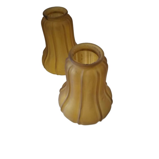 A pair of 2-inch amber frosted fluted bell Art Nouveau bell shades embodies vintage elegance with their amber-tinted,...