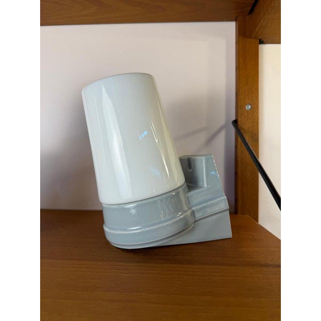 A stylish duo for your home: this set of two wall lamps, model 6070, in timeless gray, designed by sigvard bernadotte for...
