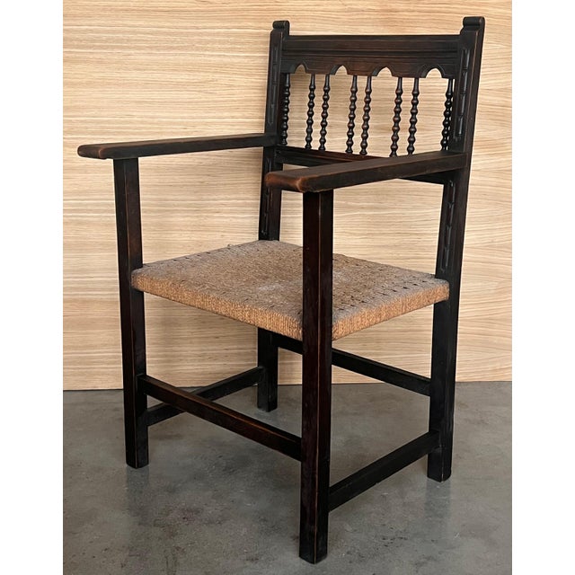 20th century pair of Catalan armchairs in carved walnut and caned seats. Country chairs.