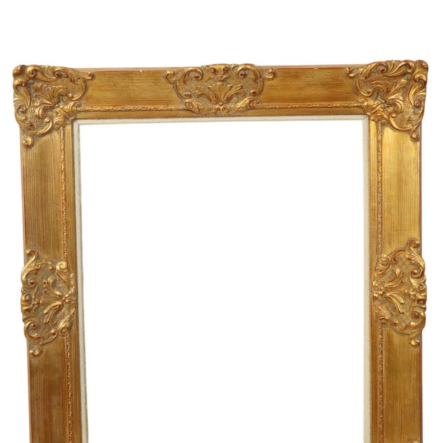 Large vintage gold-colored pine frame with a beautiful aged patina and red undertone, entirely in classic Baroque style,...