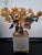 patinated bronze floral topiary cachepot featuring gleaming golden blossoms and dark patinated leaves. Bendable stems on...