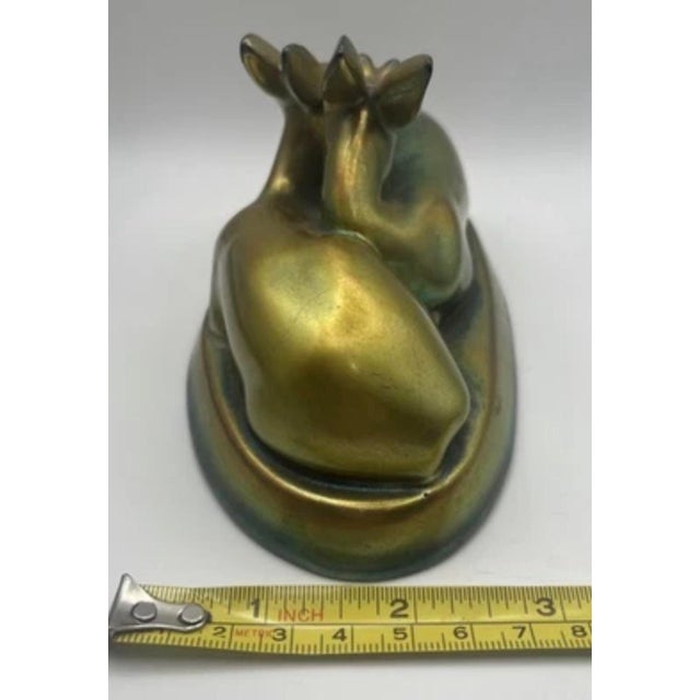 This is a vintage Zsolnay eosin glaze figure of a pair of resting deer. It was produced by the Hungarian ceramics...
