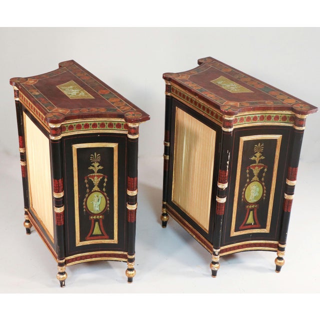 This exquisite pair of cabinets exemplifies the artistry and meticulous craftsmanship characteristic of the George IV...