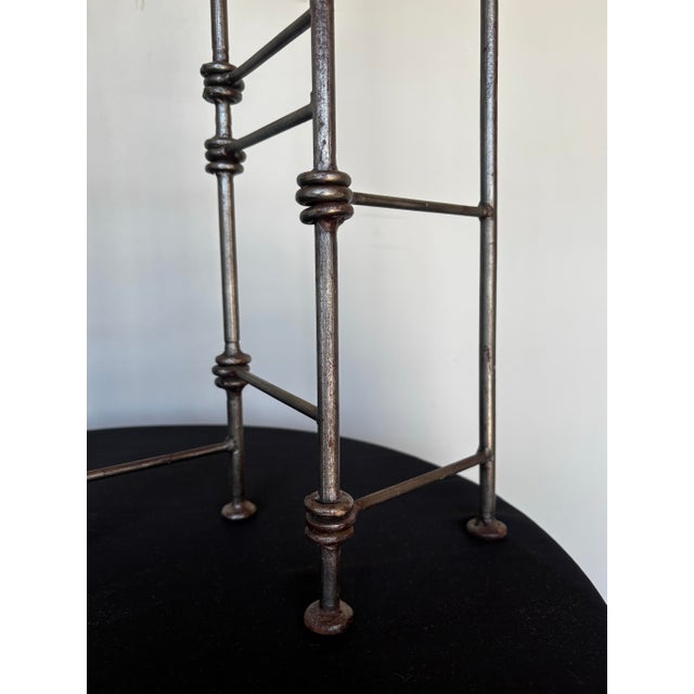 Oversized Brutalist articulating candle holder with 7 candle capacity.