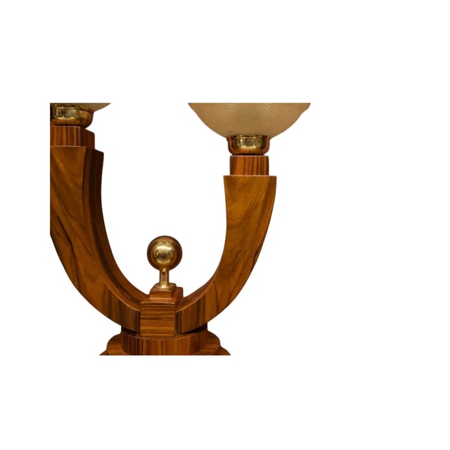 A pair of unique mid-20th century table lamps. Impressive mid-20th century table lamps. Made of walnut wood with metal...