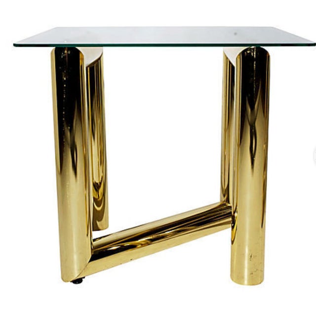 A pair of Hollywood Regency style dynamic brass Z-shaped side tables attributed to Karl Springer from 1970s. The base is...