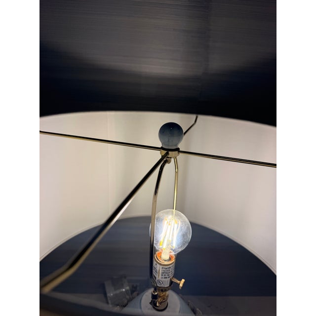 Beautiful Arteriors Pawnee Table Lamp featuring a sculptural ceramic base in a soft blue-gray laurel reactive glaze....