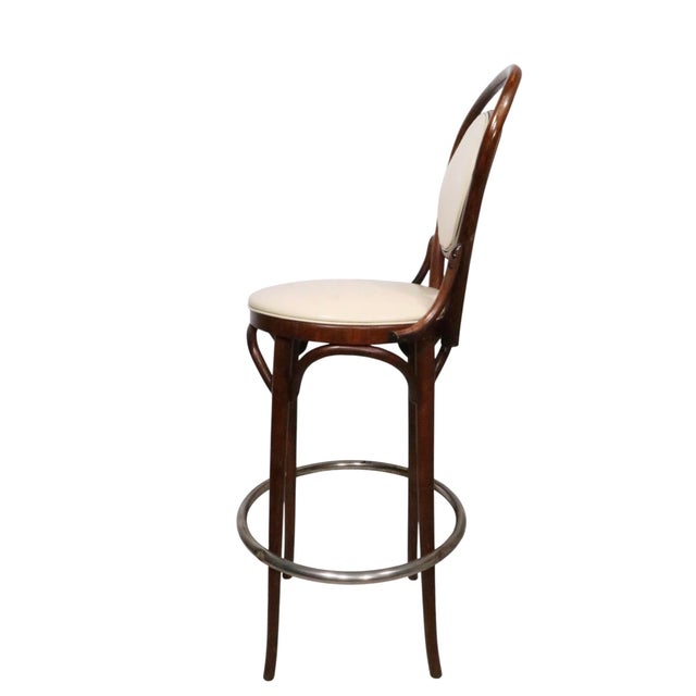 Pair of vintage bar height stools in bentwood, vinyl and chrome. The stools were made by the L. & B. Products Corp. in the...