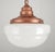 Antique Schoolhouse style pendant light with an antique milk glass globe paired with a newly made copper finish brass...