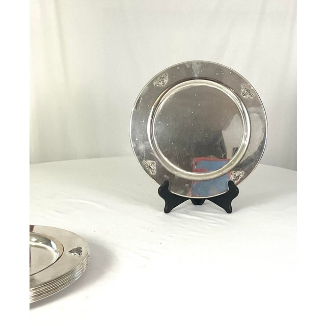 Rare set of mid-century chrome charges with grape clusters on each of the four sides Set of six 12 inches in diameter