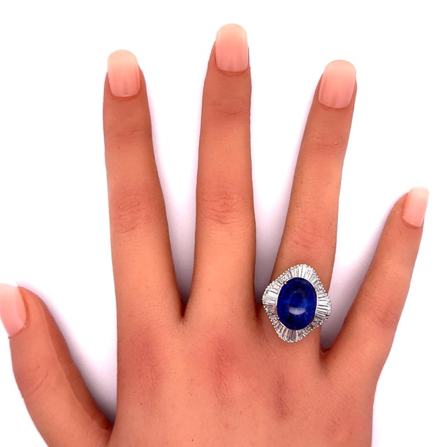 A contemporary fashion ring showcasing a captivating 9.16 carat tanzanite as its centerpiece. The stone displays a deep...