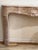 Fine French Marble Mantelpiece, 18th Century. Carved in pink and buff colored marble with a honed finish, the serpentine...