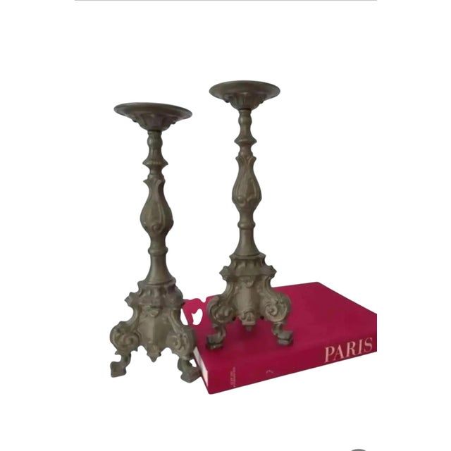 For your consideration. . . A fabulous pair of old bronze metal altar style candle holders. They are made of heavy bronze...