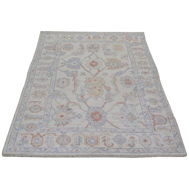 Hand-knotted with care using traditional rug-making techniques, this wool rug blends timeless craftsmanship with a modern...