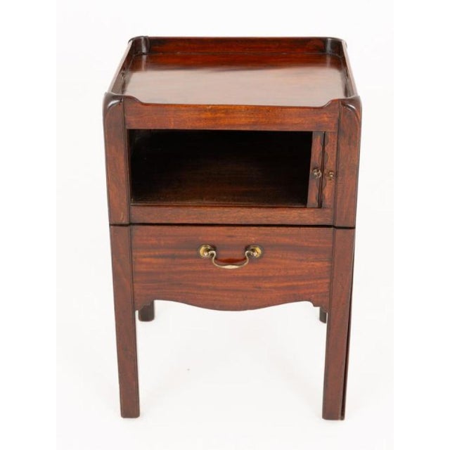 A charming Georgian mahogany bedside cabinet of classic form and excellent proportions. Raised on square legs, this...