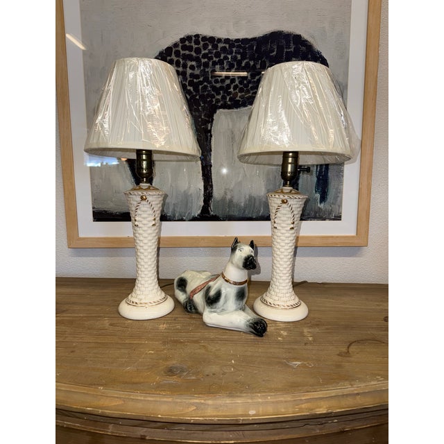 Pair of vintage basket pattern gold bow lamps. Rewired. No chips or cracks. Use clip on shade with this pairs. 14” to the...