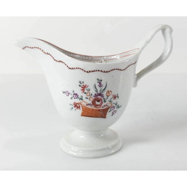 We are selling this English porcelain creamer. This creamer has floral decoration imitating 18th century Chinese export...