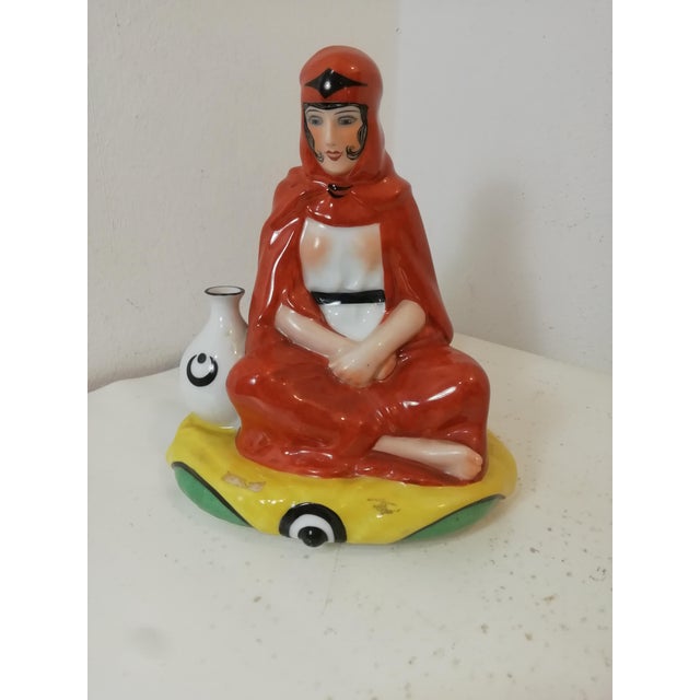 Ceramic figurine by Dimitri Chiparus for Etling Paris from the early 1900s. It represents a seated Bedouin Arab woman....