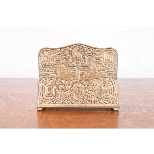 A gorgeous antique gilt bronze double sided desk letter holder rack featuring Zodiac designs By Tiffany Studios (signed to...