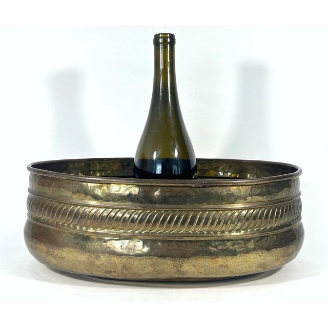 A good sized oval brass planter or jardiniere hand made in India. Decorative rope style band with rolled top. Can be used...