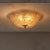 Mouth-blown in clear Murano glass with warm gold highlights, this Italian flush mount dates to the 1970s. Its textured...