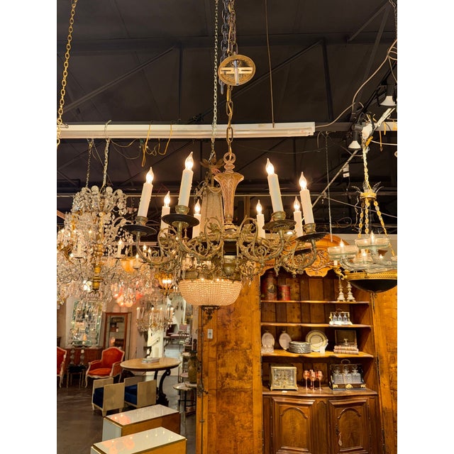 Handsome 19th century French Gothic bronze chandelier. With its intricate design and Gothic detailing, this chandelier...