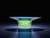 Add a touch of contemporary elegance to your home with this unique piece. Light passes through the blue and green glass...