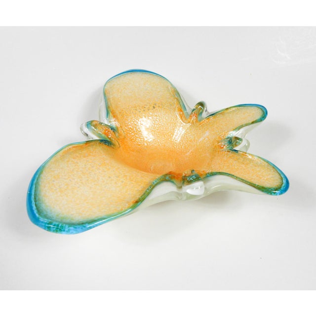 Late 20th century Murano glass bowl in the shape of a butterfly. Peach with silver flakes and turquoise edges.