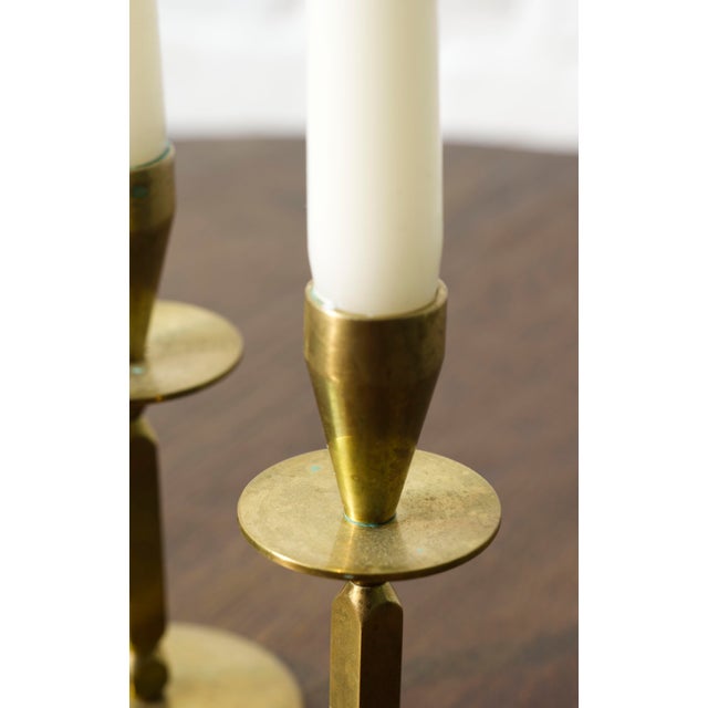 A pair of Mid century brass candle sticks, Kara Denmark. Solid brass and quality made in Denmark. Marked by the maker at...