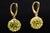 The Eucla: Peridot Dangle Disco Earrings in Yellow Gold. The earrings feature round brilliant cut natural peridot bead set...
