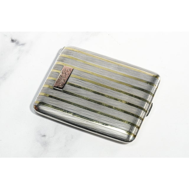 A refined statement of 1920s Art Deco sophistication, this exceptional sterling silver cigarette case is a masterclass in...